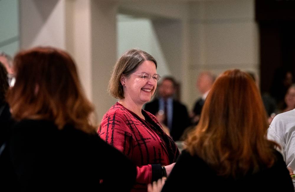 Woman smiles at reception